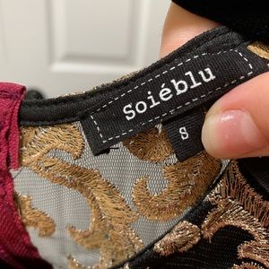 Formal dress, sleeves added. See through back. Burgundy bottom